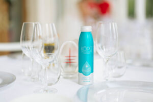 KOPU Sparkling water aluminum can on table.